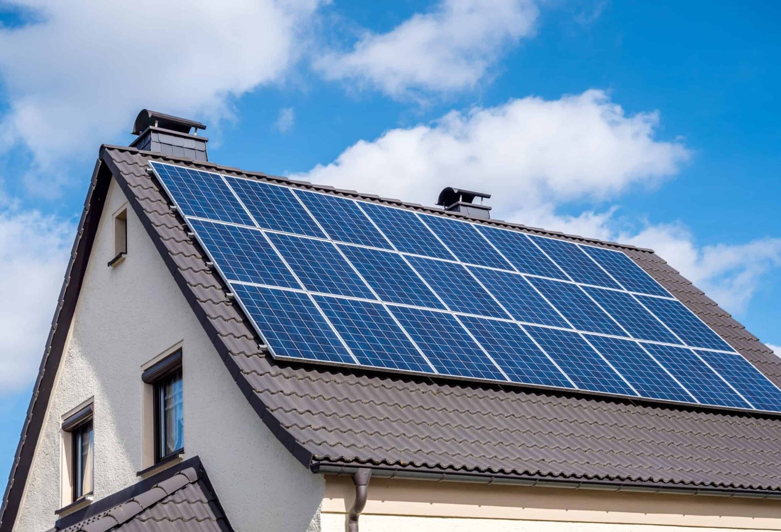 services-02 white-home-scallop-roof-and-solar-panels-shutterstock-1336991930-scaled-1-scaled